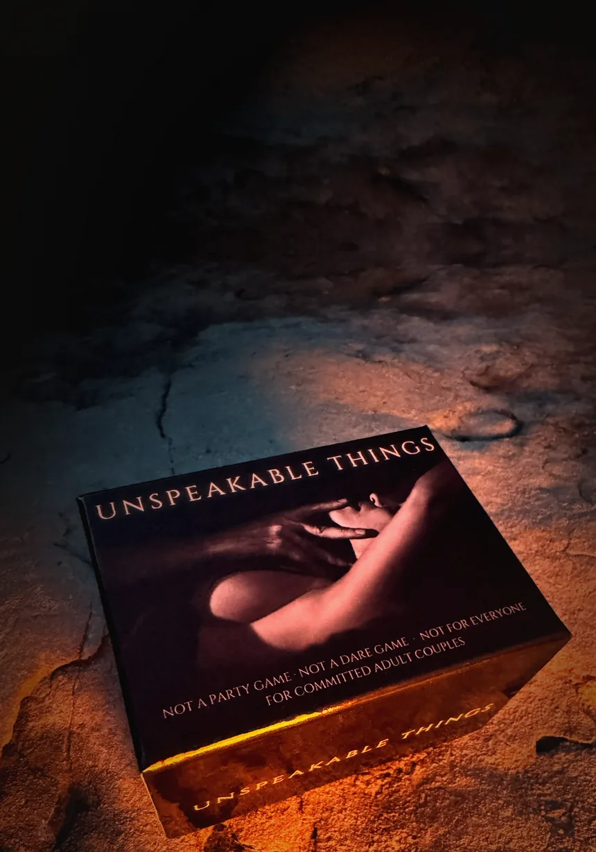 The Unspeakable Things box, lit on stone at night