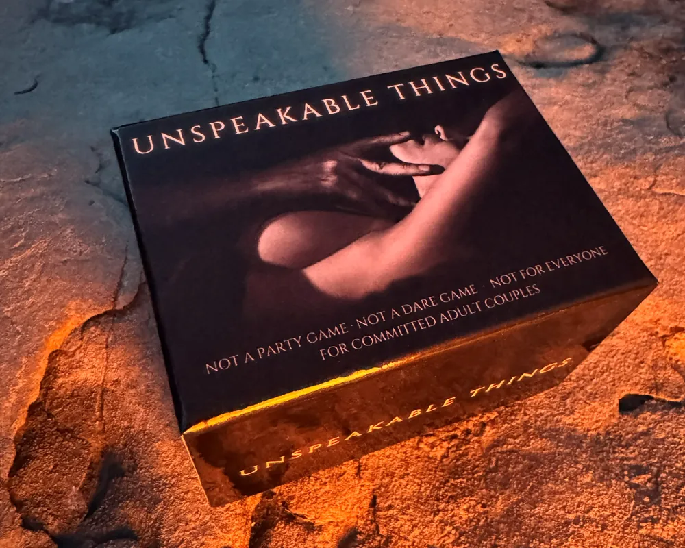 The Unspeakable Things box on stone, lit in amber