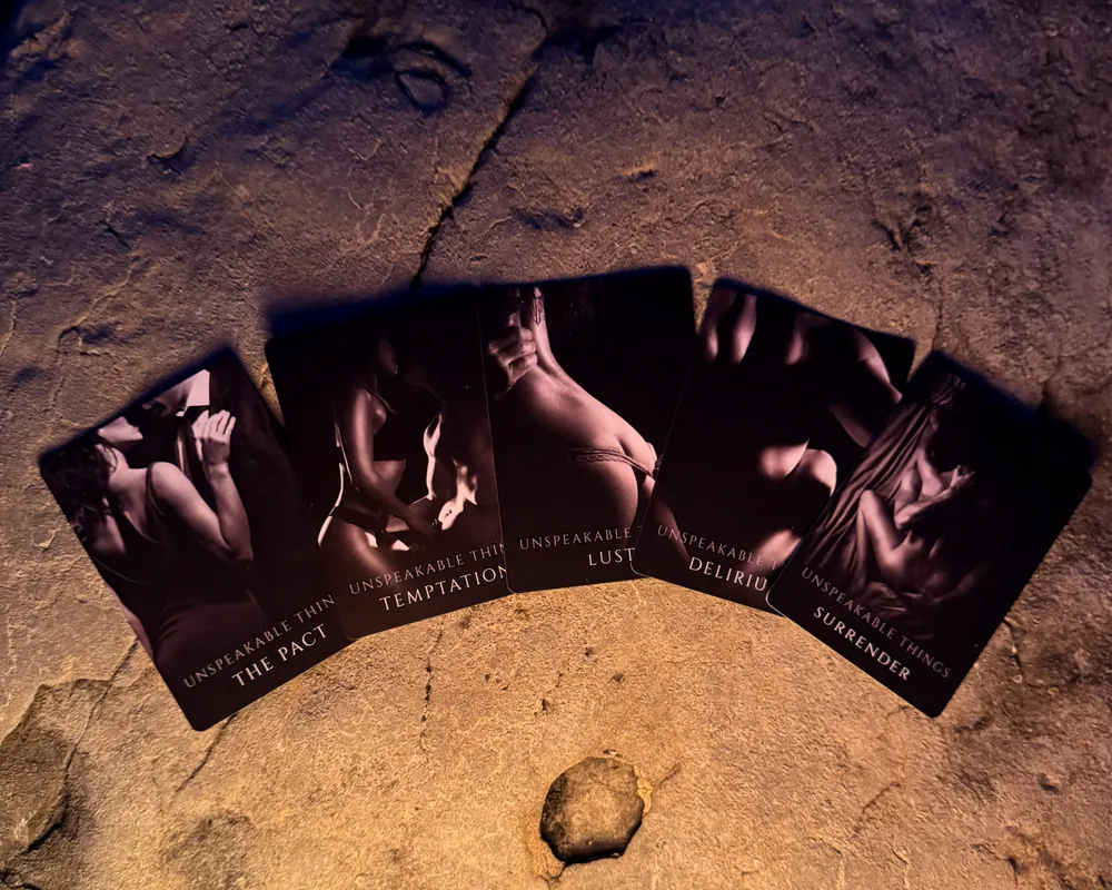 Five cards fanned out, one for each tier: The Pact, Temptation, Lust, Delirium, Surrender